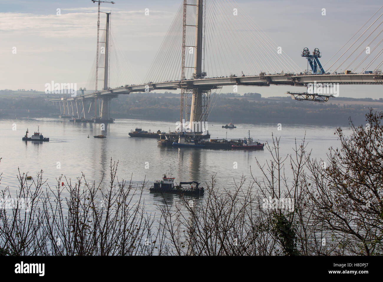 Queensferry, Edinburgh, Scotland, 11th, November, taken from the first Road Bridge. The 2nd Road bridge is nearing completion with the last segment of the northerly section being winched into position from the pontoon floating below.  Phil Hutchinson/Alamy Live News Stock Photo