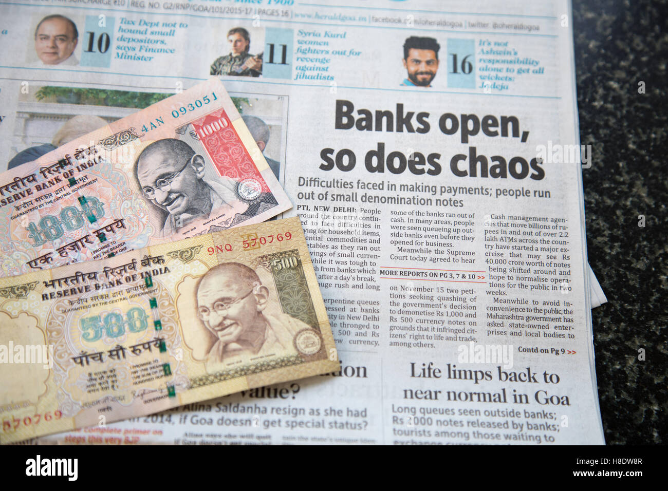 Varca, India. 12th Nov, 2016. Goa, India. Saturday 12th November 2016. Indian 500 and 1000 rupee notes demonetised leading to chaos in banks and shops. Regional newspaper the Herald in Goa headlines the problem. Two discontinued bank notes are shown. Credit:  WansfordPhoto/Alamy Live News Stock Photo
