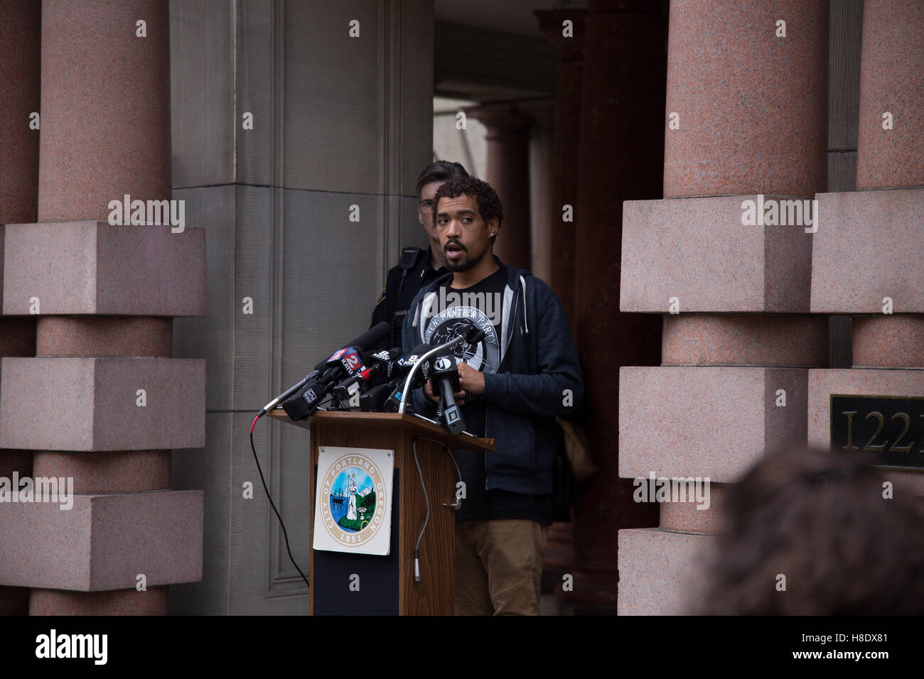 Portland, USA. 11th November, 2016. Portland Oregon 'Not My President' protest organizer speaks during a press conference urging people not to riot in the wake of the 2016 presidential election. Rioters have caused more than one million dollars in damages to the city of Portland during the 'Not My President' protests. Credit:  Joshua Rainey/Alamy Live News. Stock Photo