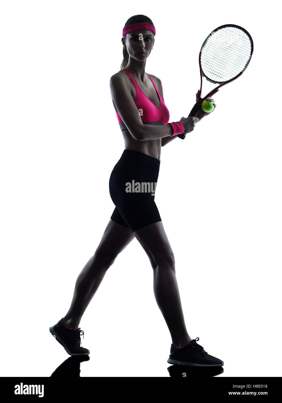 one woman tennis player  in studio silhouette isolated on white background Stock Photo