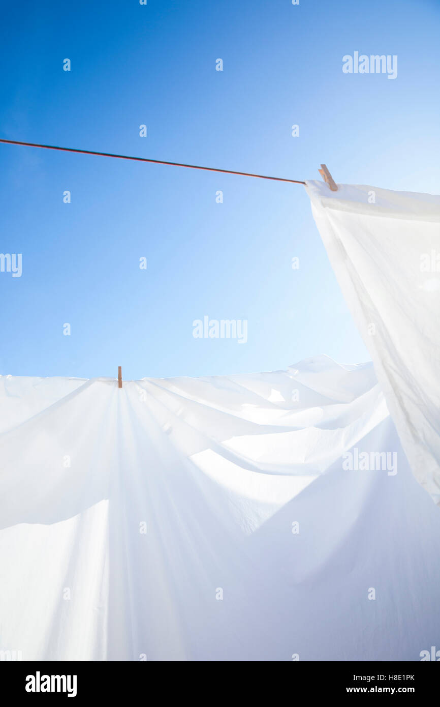 Clean white sheets drying in the sun Stock Photo Alamy