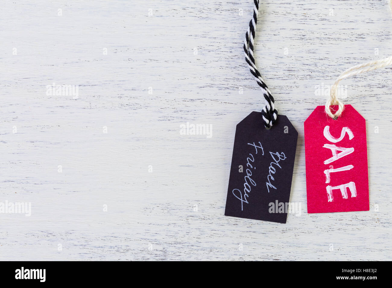 Tags with sale sign on wood board Stock Photo Alamy