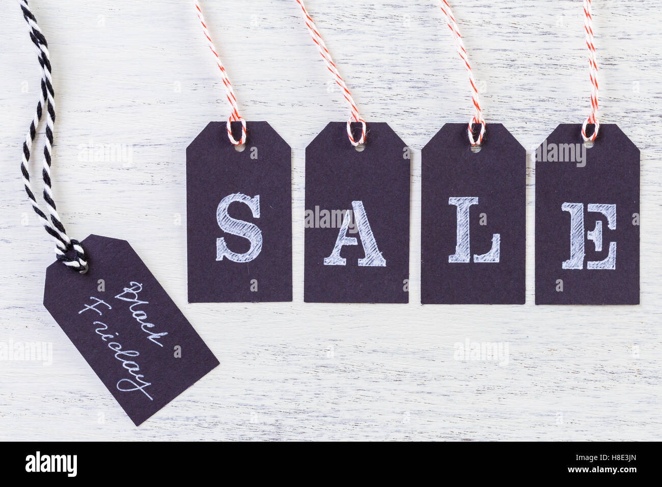 Tags with sale sign on wood board Stock Photo Alamy