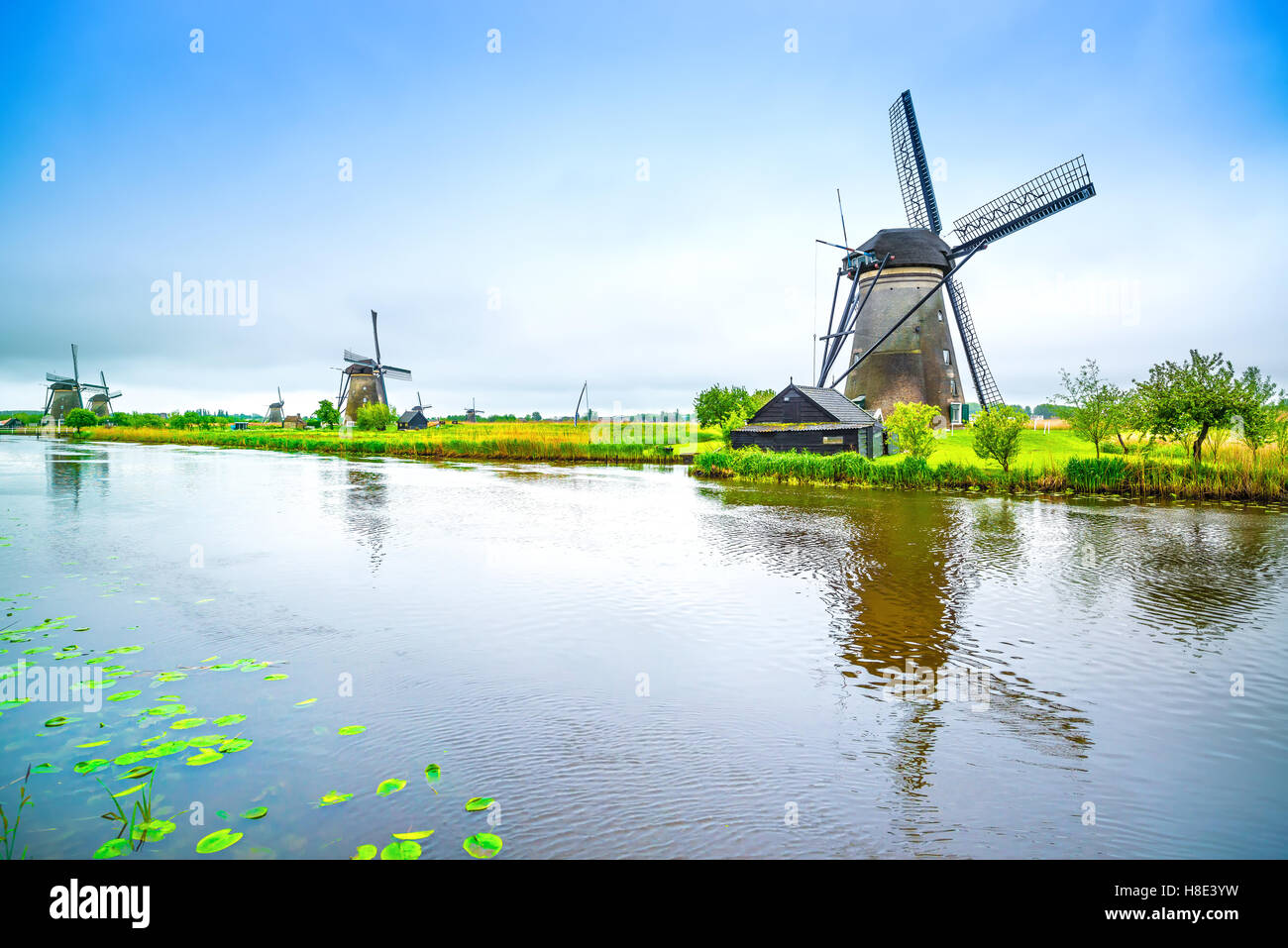Windmills and water canal in Kinderdijk, Holland or Netherlands. Unesco