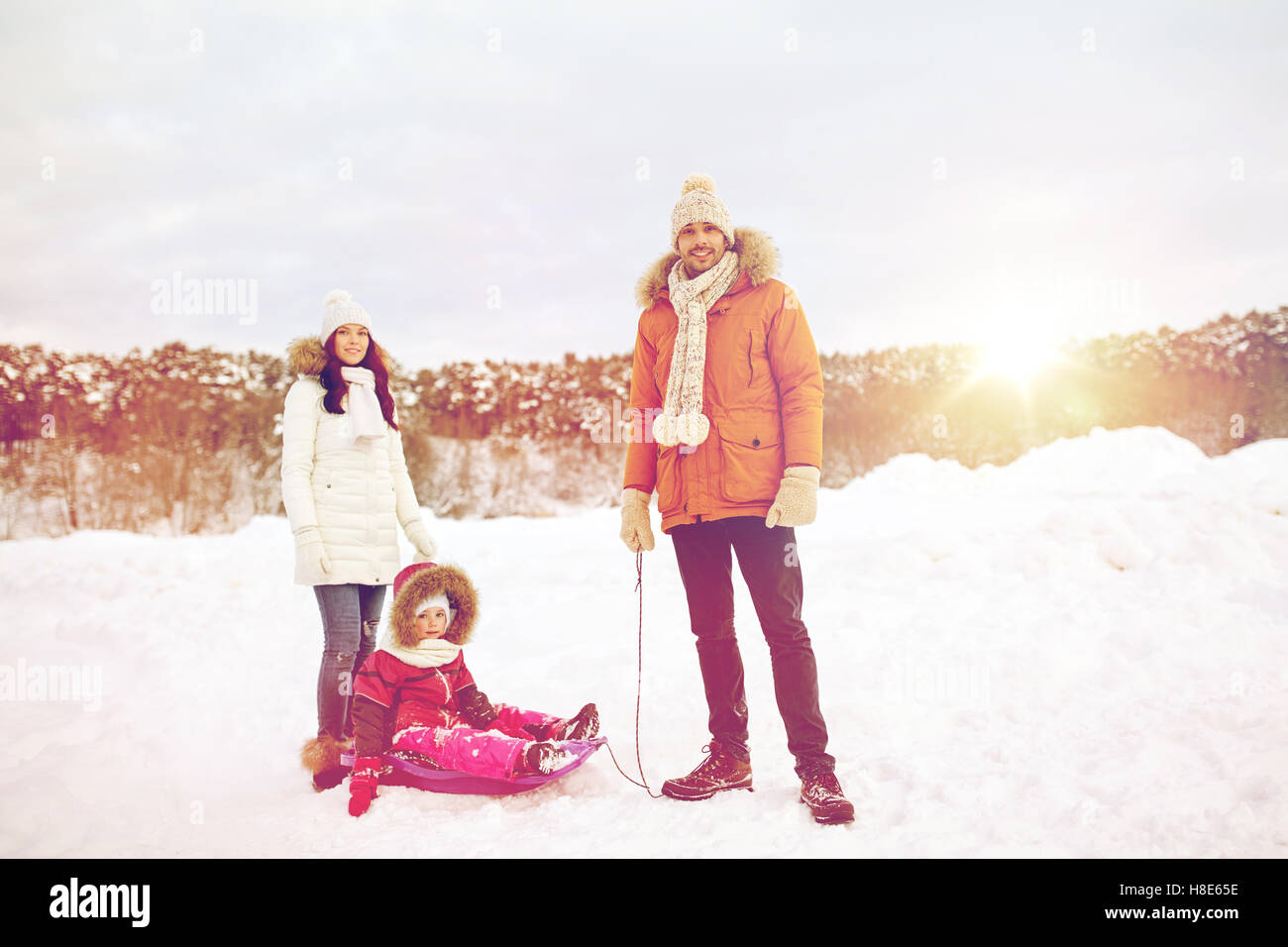 happy family with sled walking in winter outdoors Stock Photo - Alamy