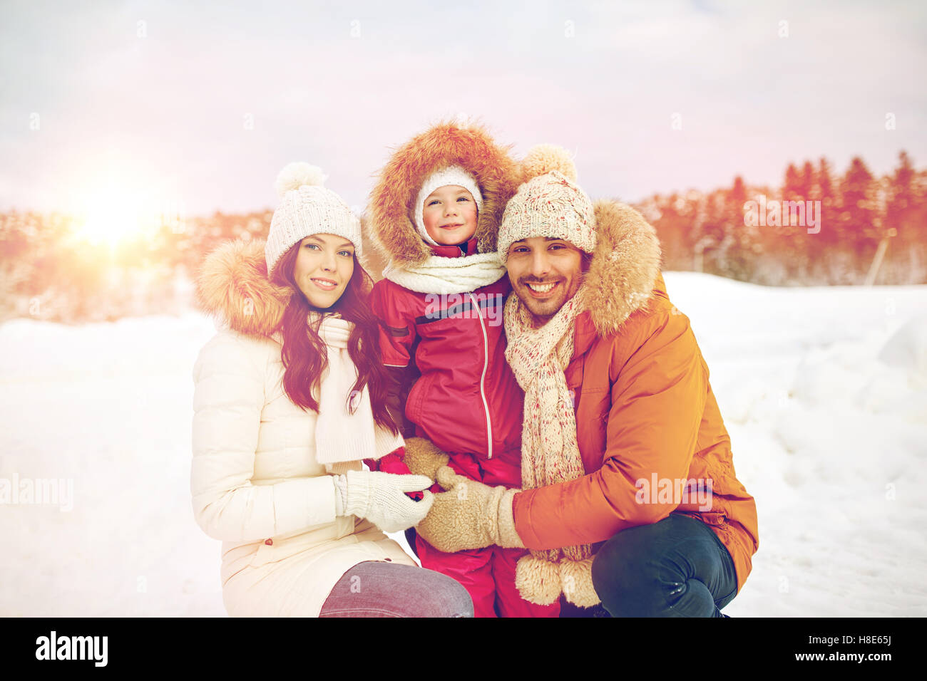 happy family with child in winter clothes outdoors Stock Photo - Alamy