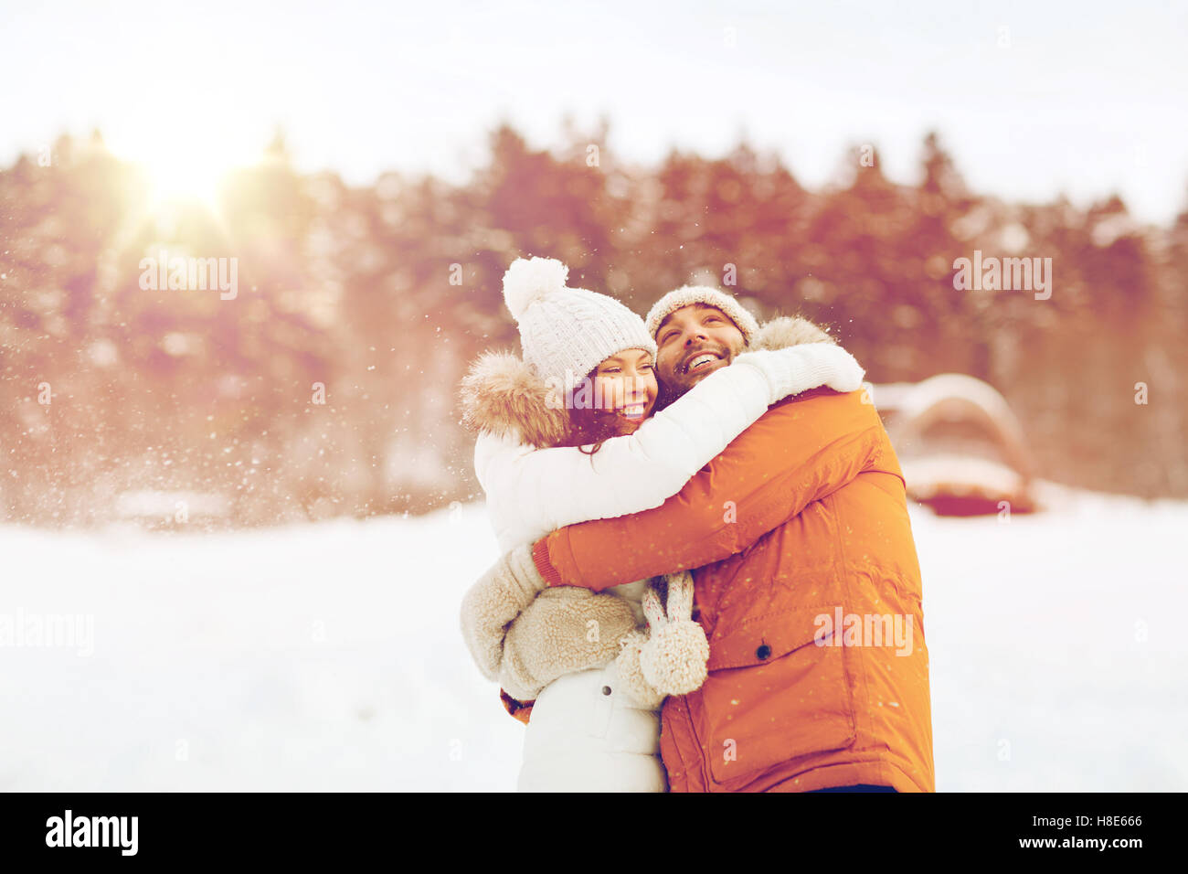 happy couple hugging and laughing in winter Stock Photo - Alamy