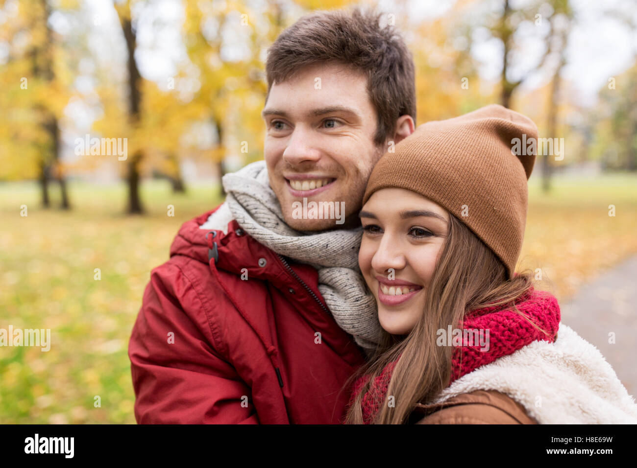 happy young couple walking in autumn park Stock Photo - Alamy