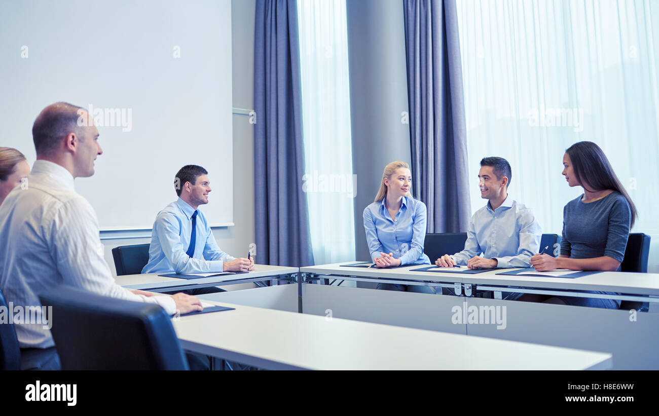 group of smiling businesspeople meeting in office Stock Photo - Alamy
