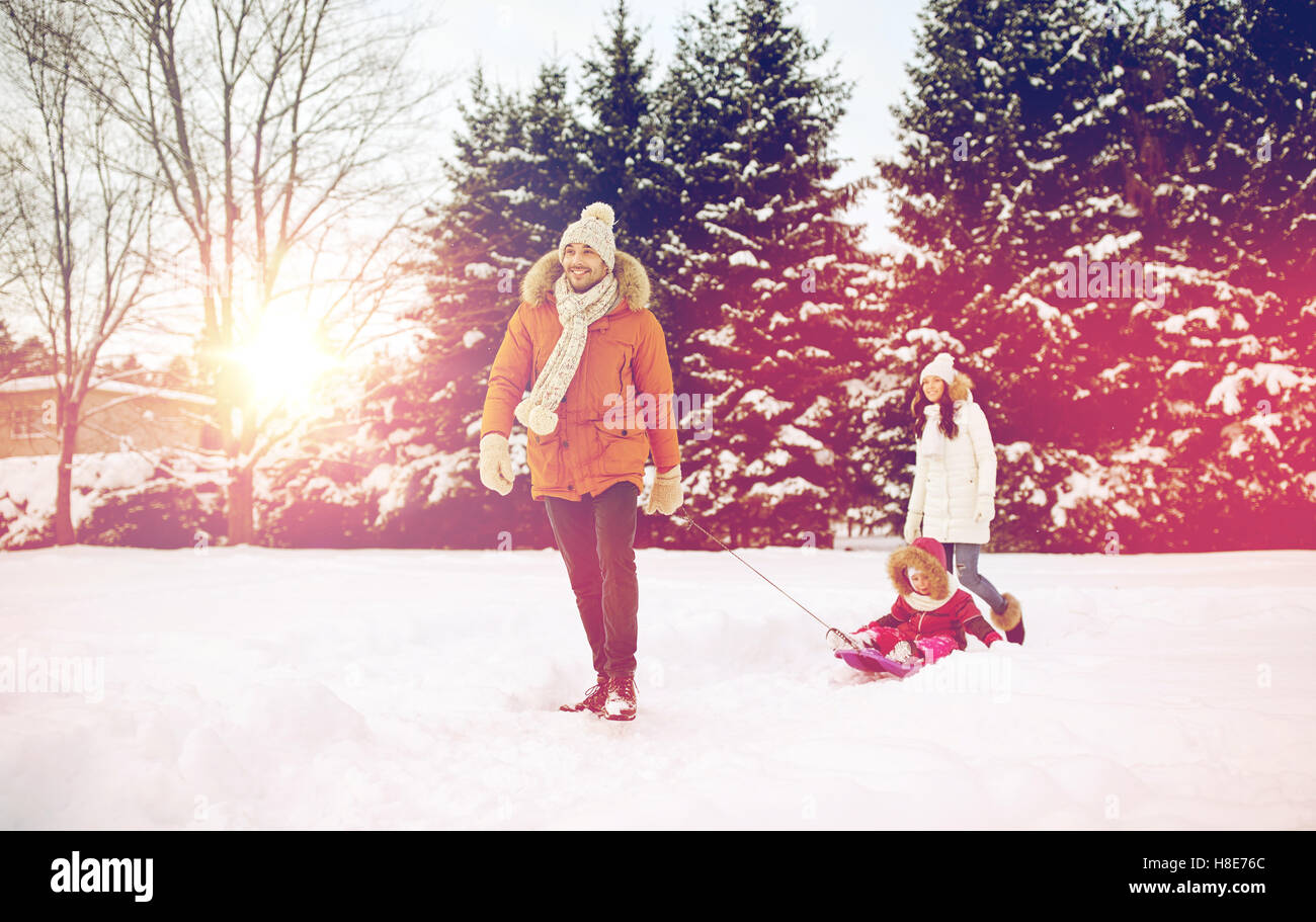 happy family with sled walking in winter outdoors Stock Photo - Alamy