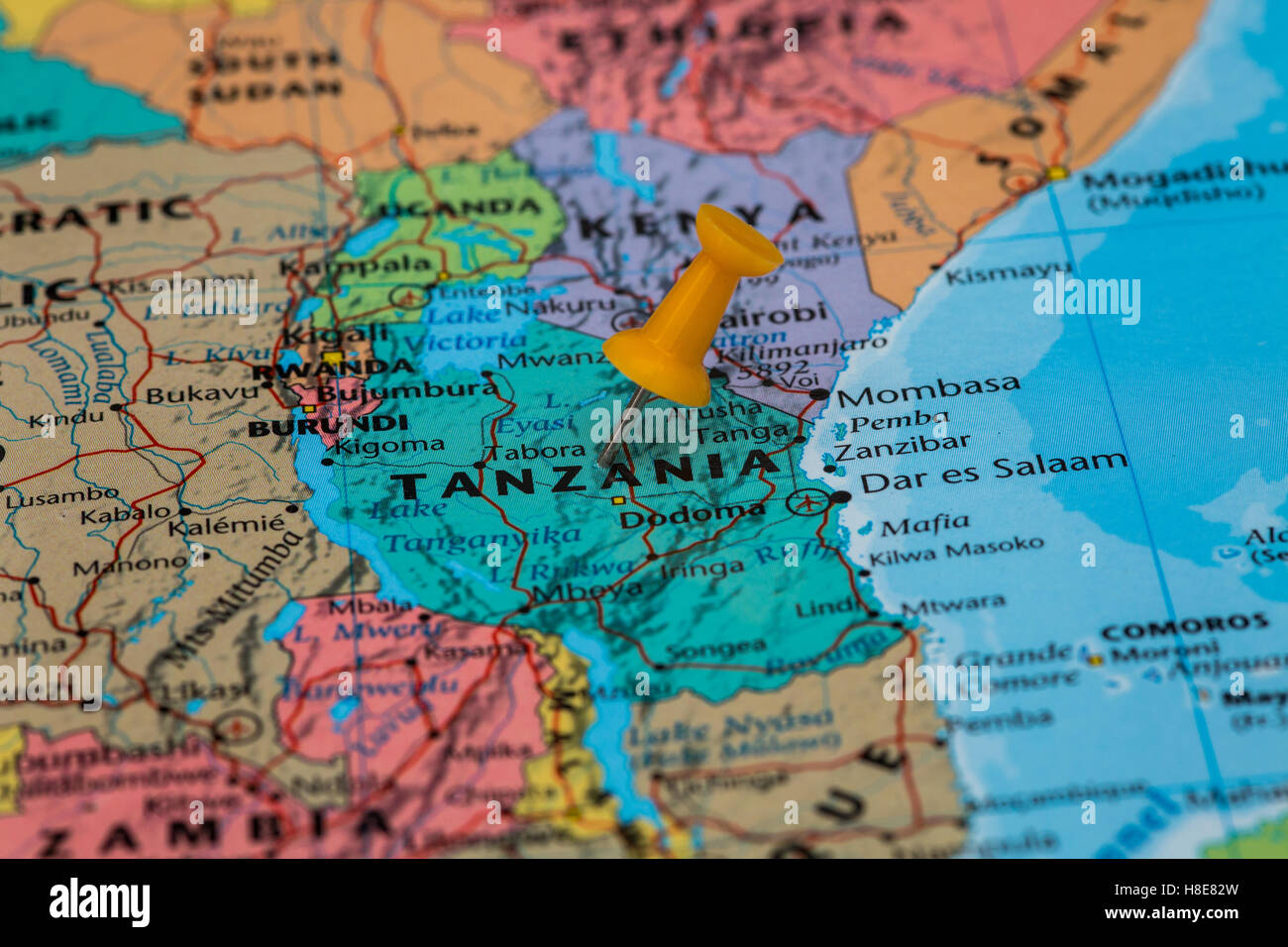 Map of Tanzania with a orange pushpin stuck Stock Photo