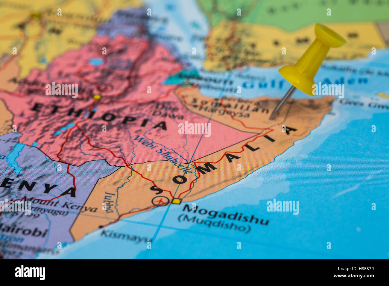 Map of Somalia with a yellow pushpin stuck Stock Photo