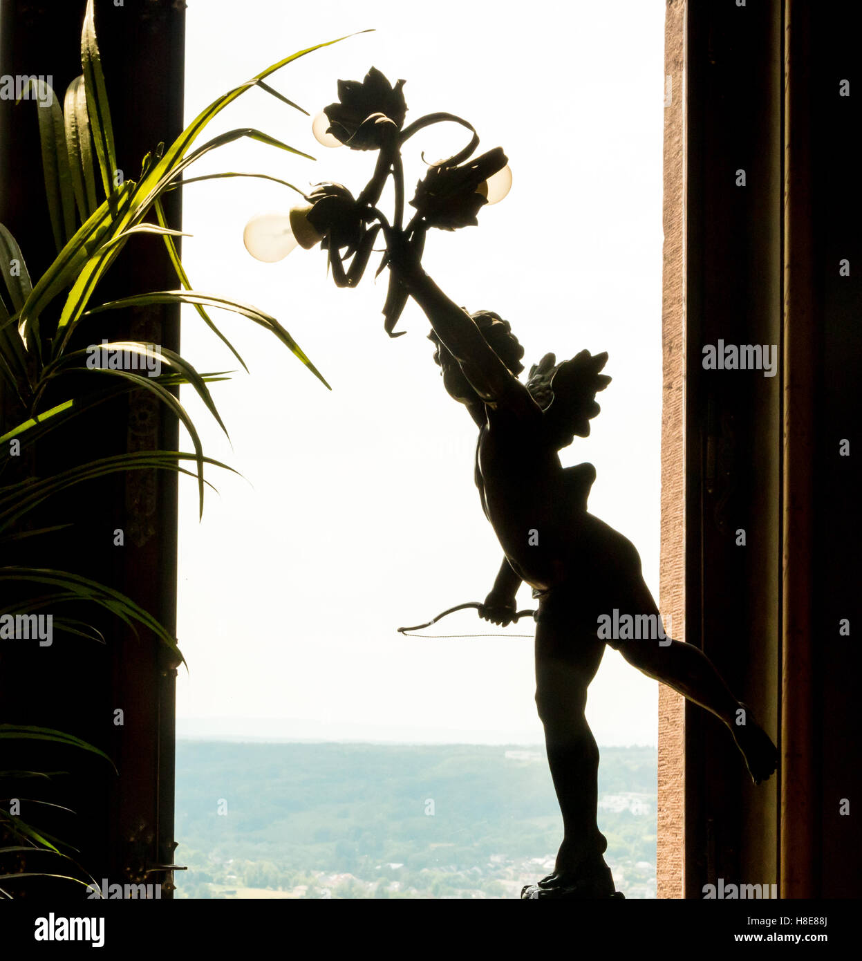 Statue of Cupid or Eros, God of love with bow and arrow, Drachenberg Castle, Konigswinter,  Germany Stock Photo