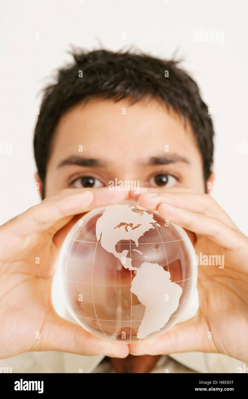 man holding glass globe Stock Photo
