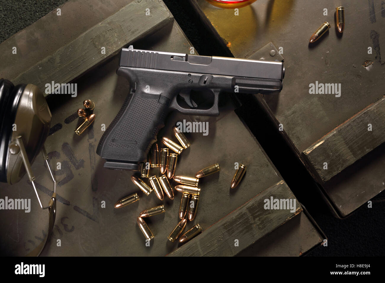 Glock pistol, cartridges and headphones protect ears Stock Photo Alamy