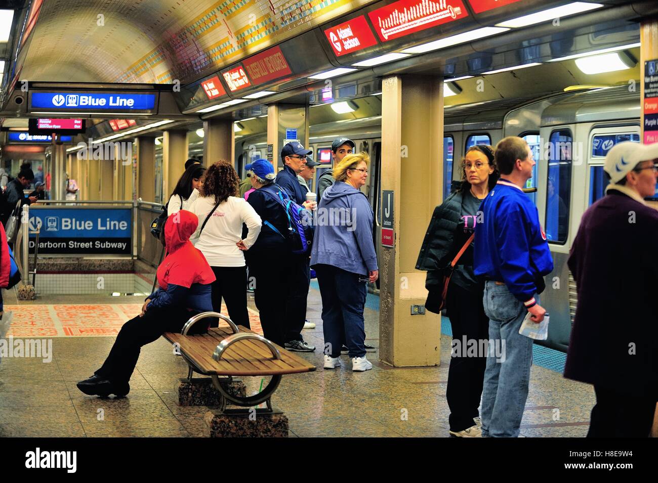 Passengers await subway trains at the Jackson Boulevard subway stop below Chicago's Loop. Stock Photo