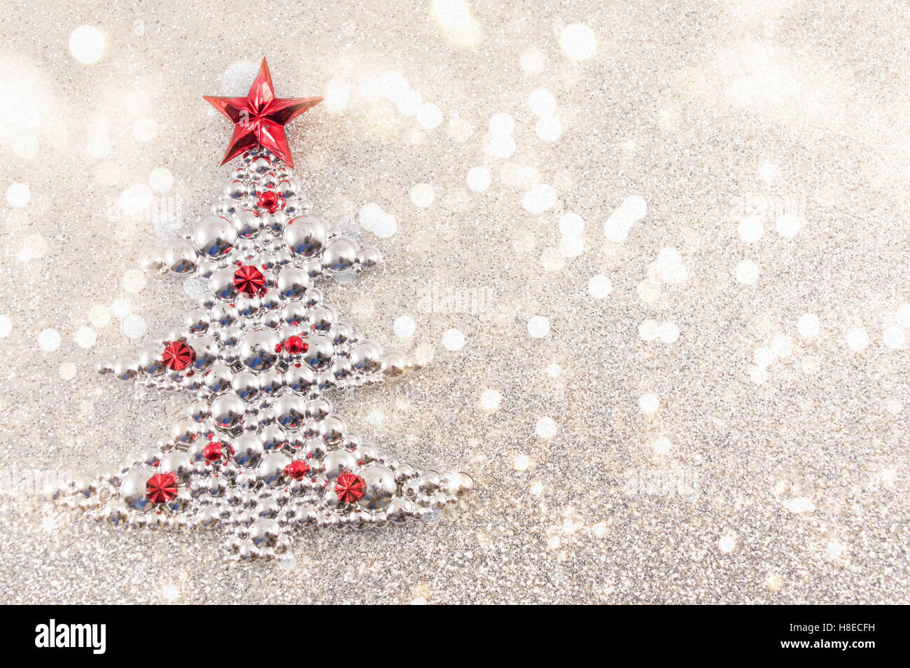 Christmas tree decoration with silver glitter background. Celebrating Christmas Stock Photo