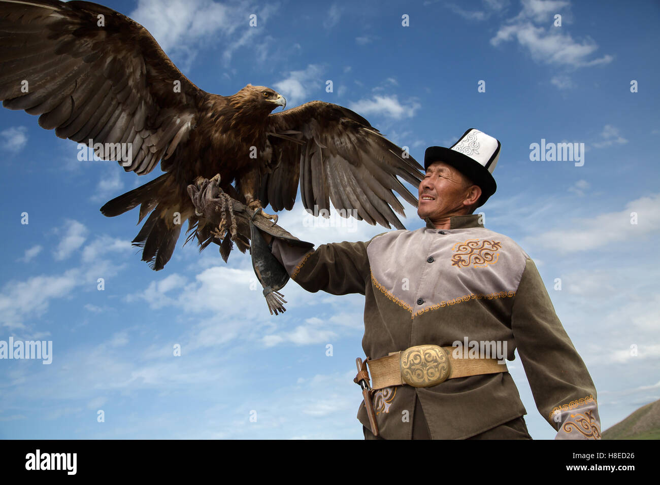 Eagle hunter in Bokonbayevo - Kyrgyzstan -  Travel people Central Asia Stock Photo