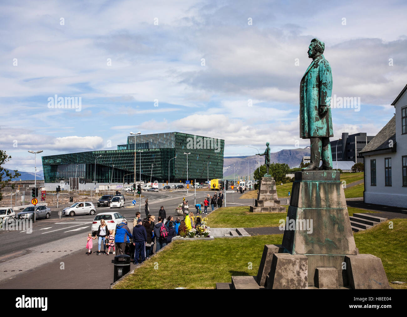 Hannes Hafstein Statue on right and Harpa Concert Hall in the background, Reykjavik, Iceland, Reykjavík, city summer Europe Stock Photo