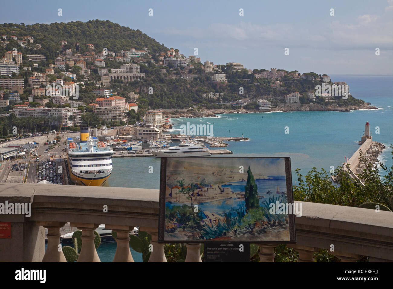 The Port of Nice wth Mont Boron beyond viewed from Château Hill with artwork in foreground Stock Photo