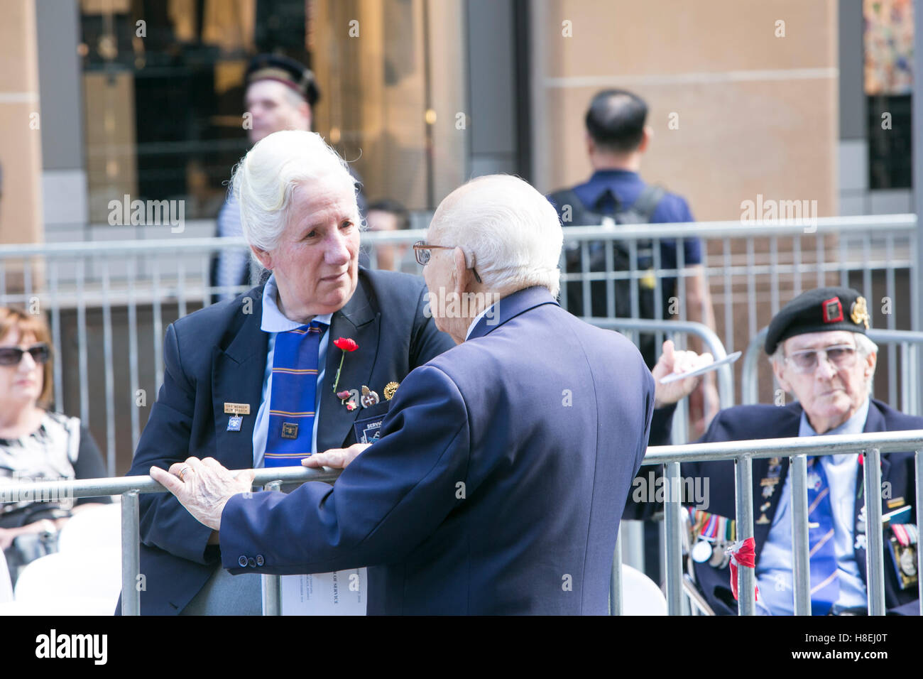 Two elderly former military personnel enjoying a conversation at the Remembrance day service in martin place,Sydney Stock Photo
