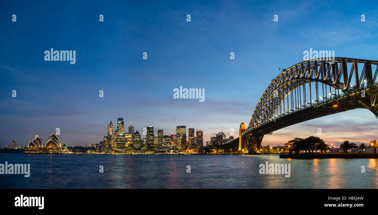 Sydney's iconic buildings lit up as dusk settles over the city, Sydney, New South Wales, Australia, Pacific Stock Photo