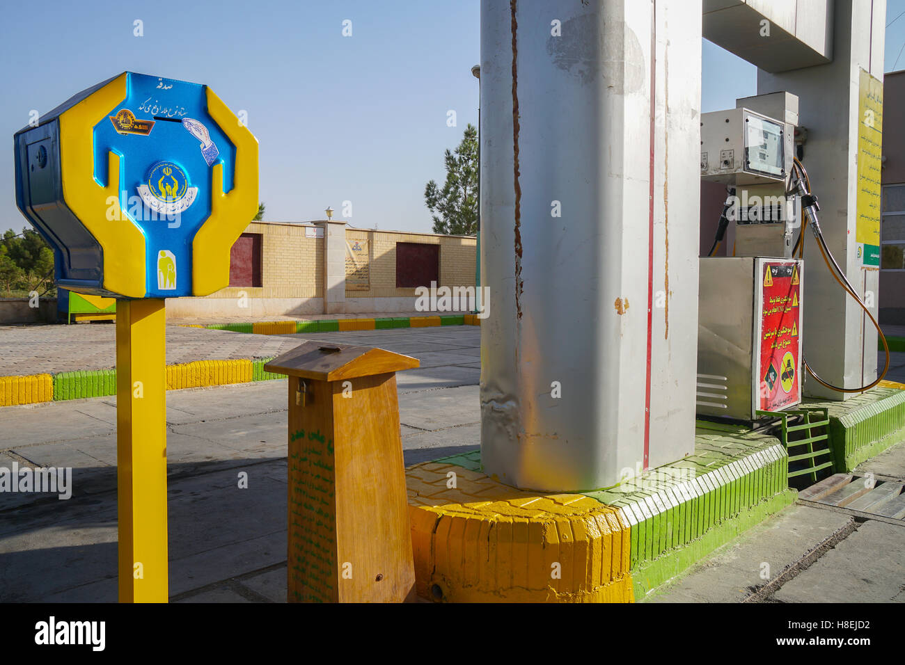 Two dominant themes of religion and oil meet at the petrol station, Varzaneh, Iran, Middle East Stock Photo