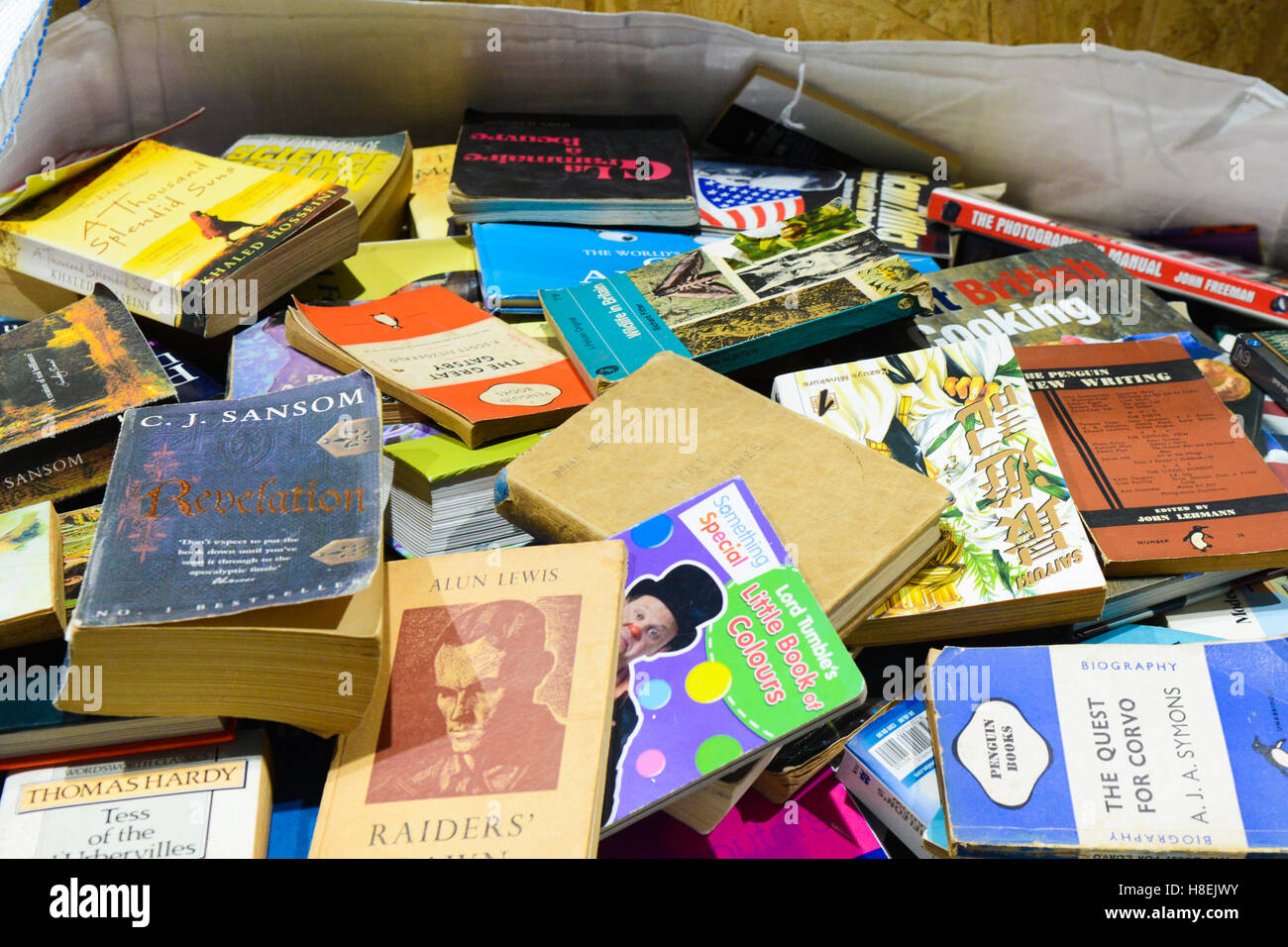 A pile of old novels and books with look to have been read. The books are piled on top of each other. Stock Photo