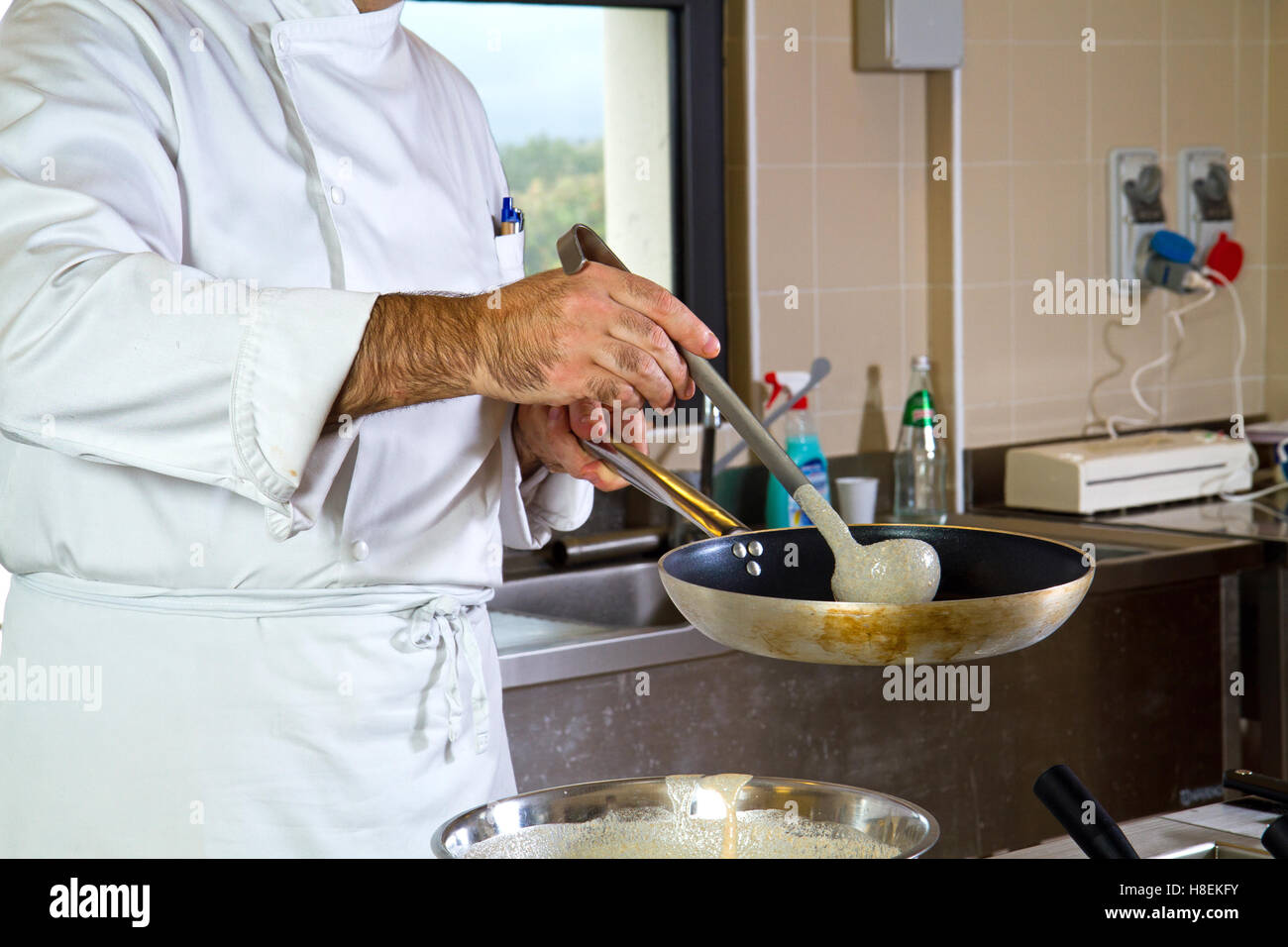 Working Condition Cook cook at work in a kitchen restaurant Stock Photo - Alamy