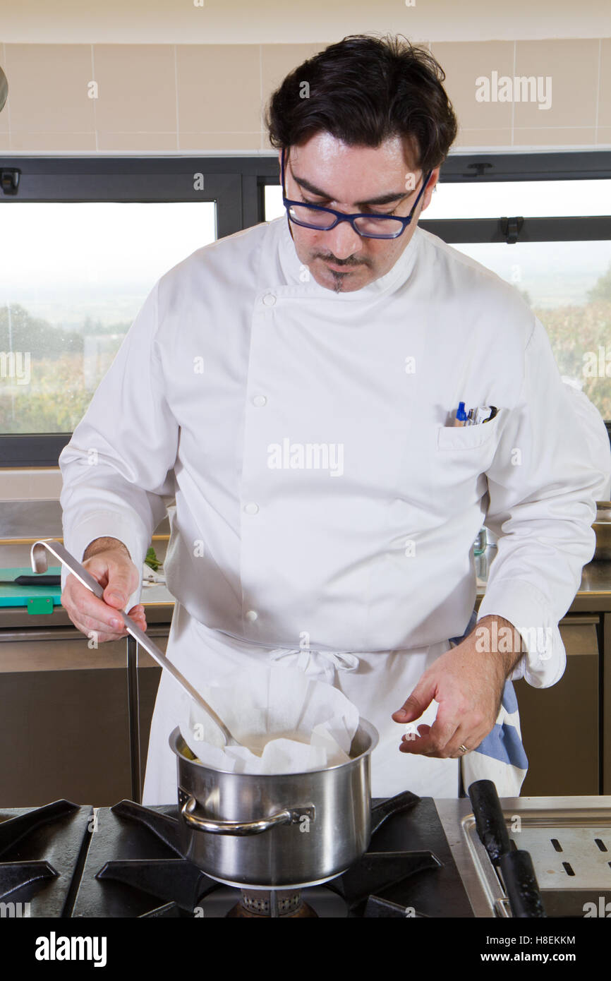 Work About Cook cook working in a kitchen restaurant Stock Photo - Alamy