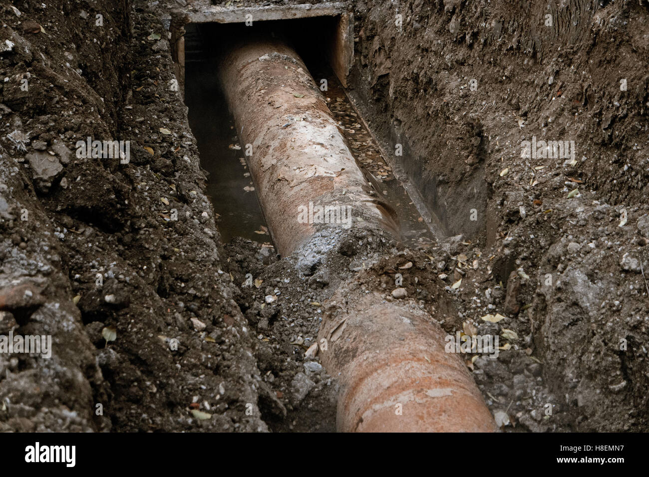 Rusty water pipeline in the trench ground view Stock Photo Alamy