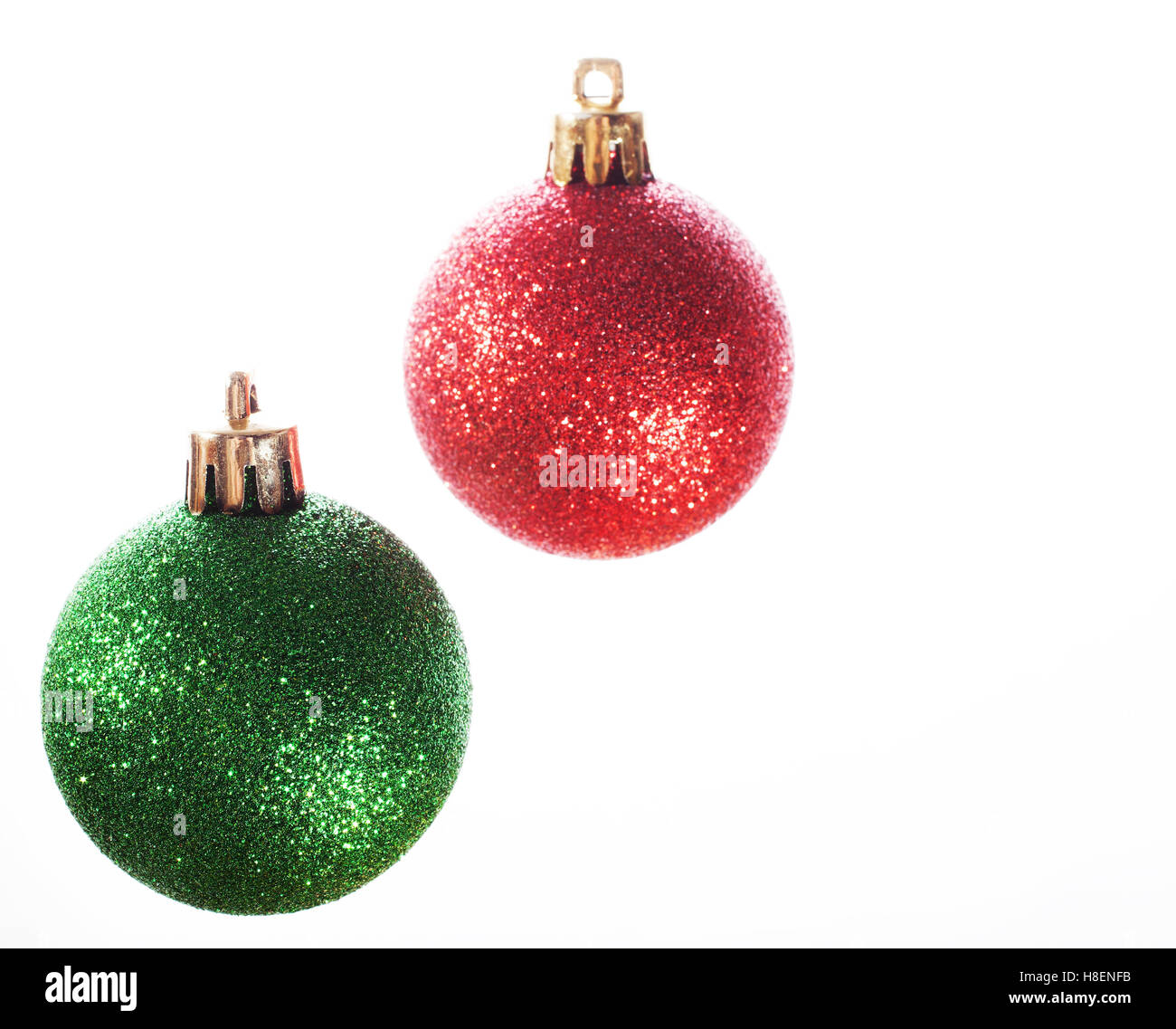 Red and green Christmas ornaments with a white background Stock Photo