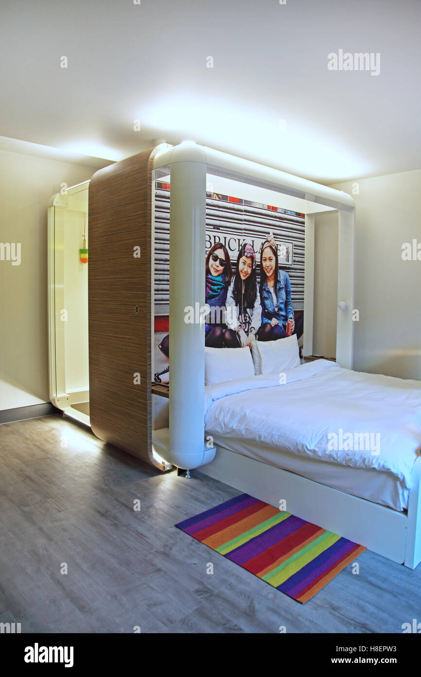 Trendy hotel room in London's Brick Lane area, Whitechapel, featuring a self-contained bathroom pod Stock Photo