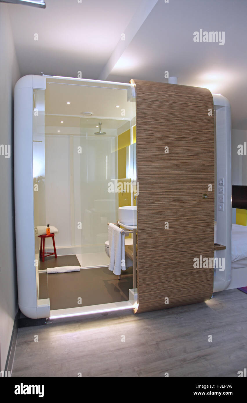 Trendy hotel room in London's Brick Lane area, Whitechapel, featuring a self-contained bathroom pod Stock Photo