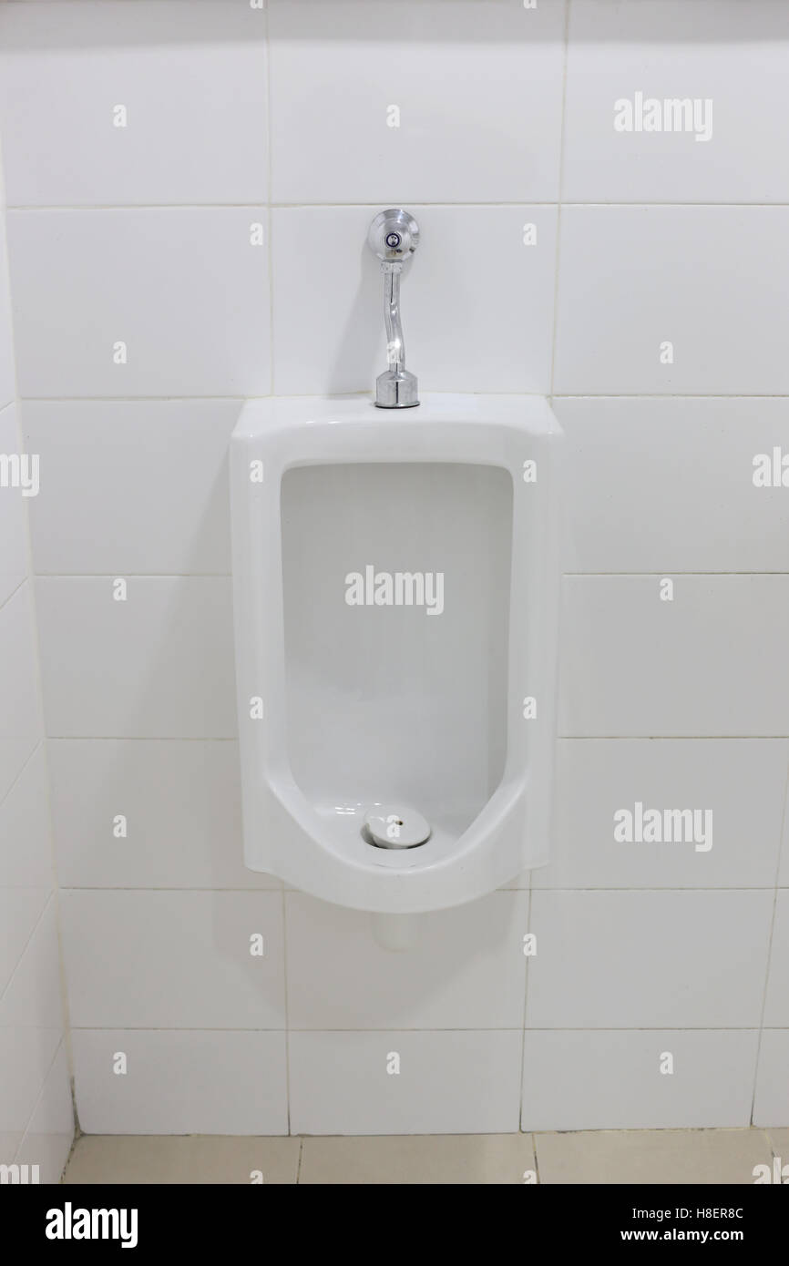 Modern urinal in men bathroom, white ceramic urinals for men in toilet room Stock Photo Alamy