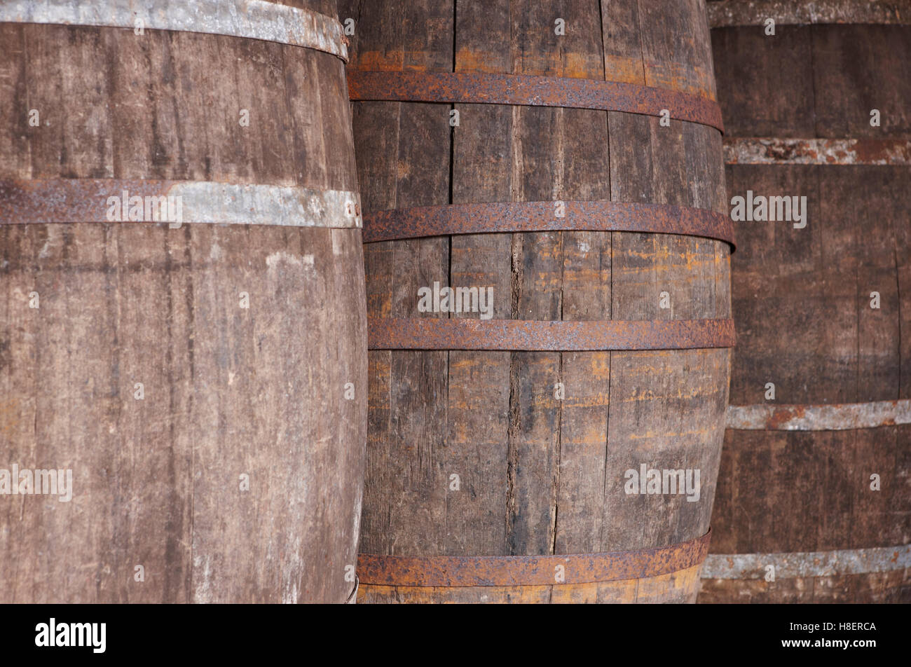 Old wine wooden barrels detail in a winery. Warm tone. Horizontal Stock Photo