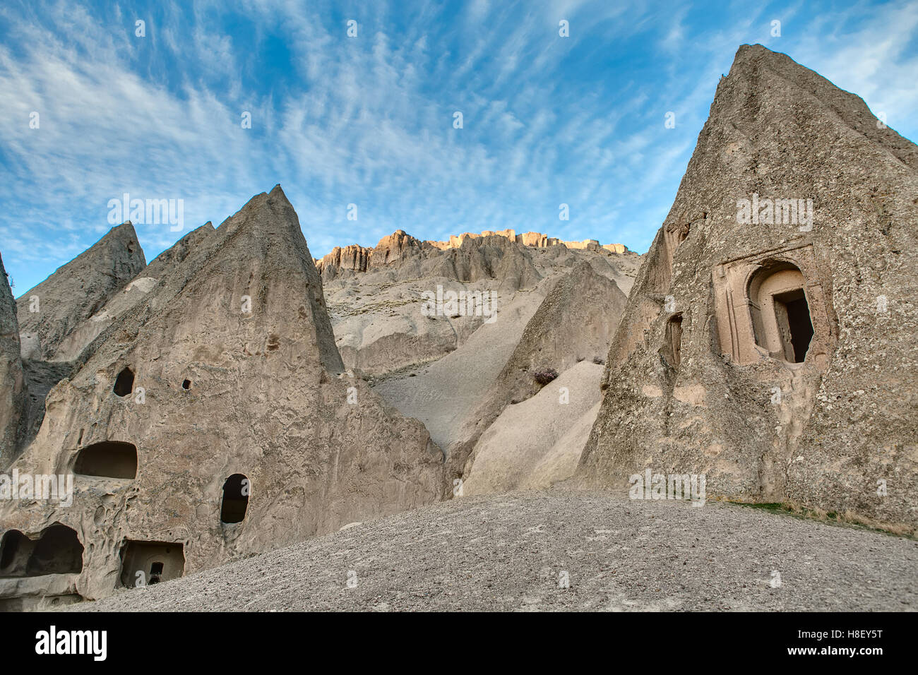 Houses carved into rock Stock Photo - Alamy