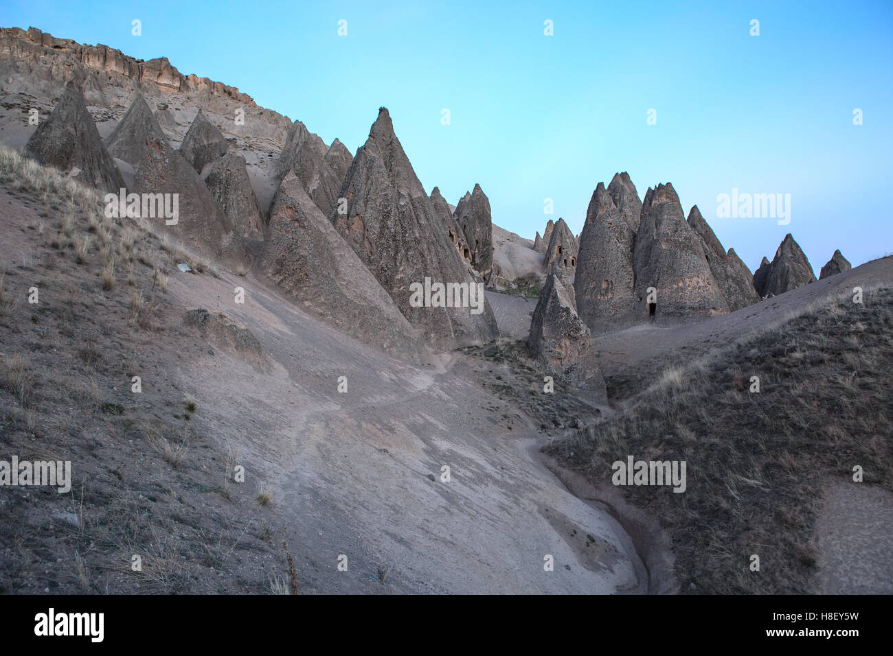 Houses carved into rock Stock Photo - Alamy