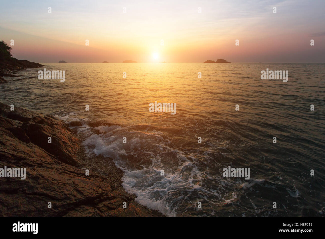Sunset at rocky sea coast. Stock Photo