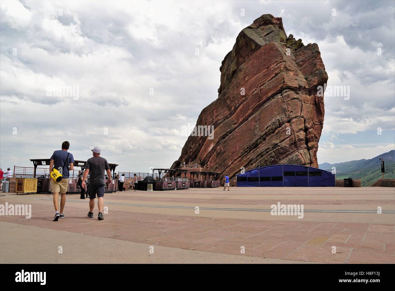 People Walking near a Big Red Rock at Red Rocks Amphitheater, Denver Stock Photo