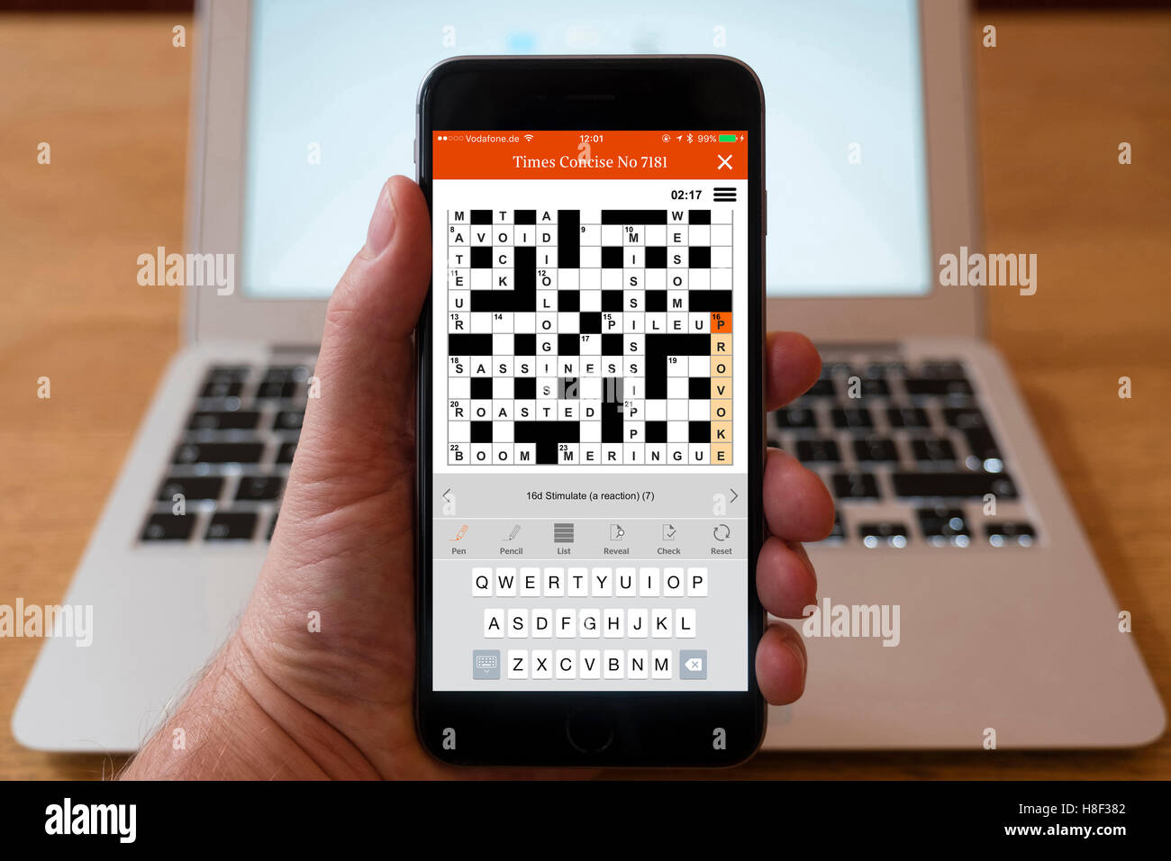 Detail of The Time crossword puzzle being solved on a smart phone Stock Photo