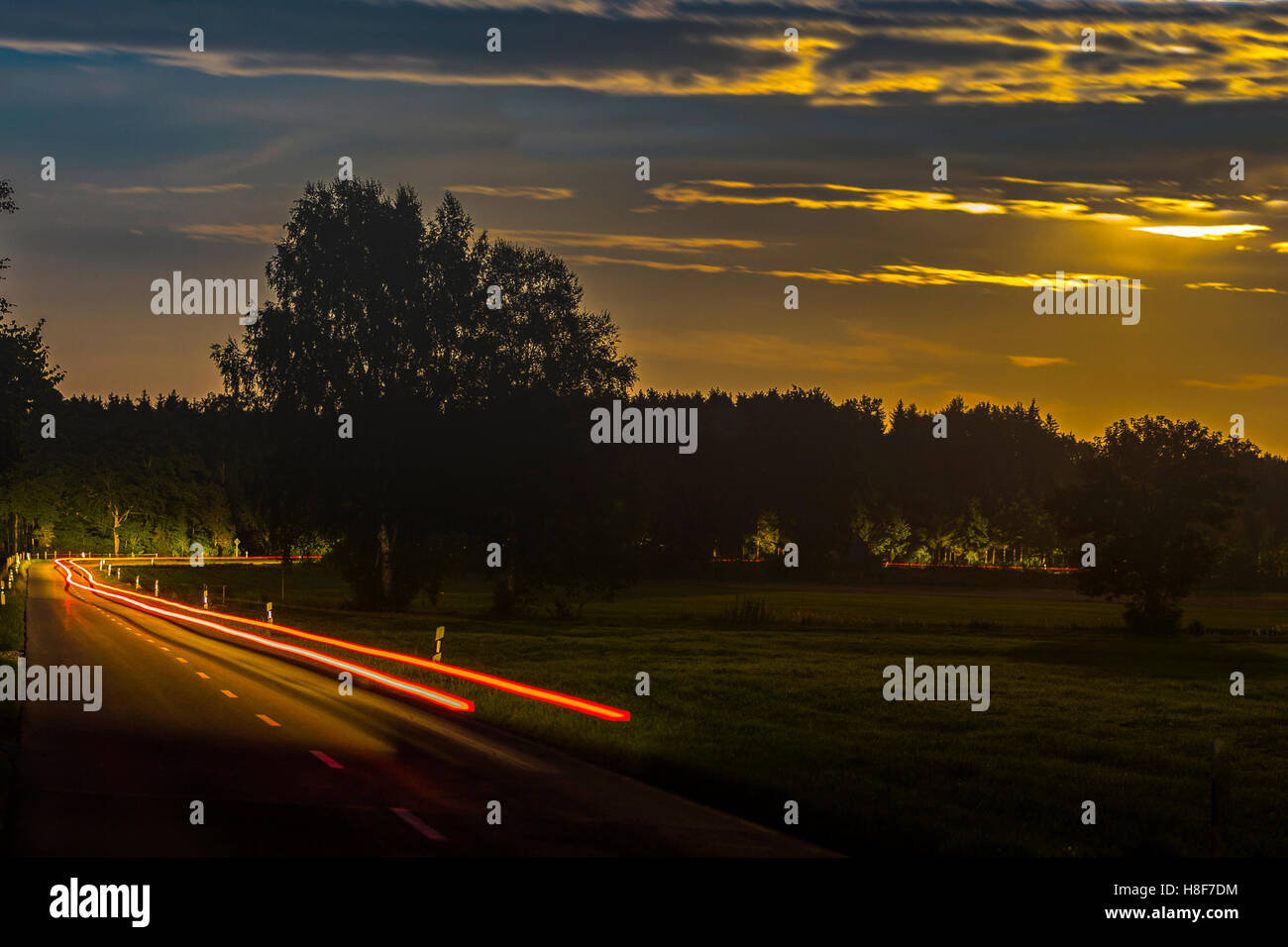 Tracer of a car at night, winding road, Allgäu, Bavaria, Germany Stock Photo