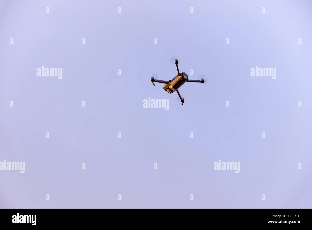 Close up of small modern drone taking photo while hovering Stock Photo