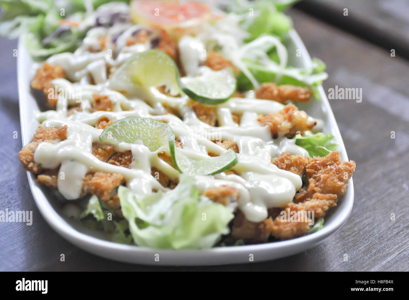 crispy chicken with lime sauce dish Stock Photo