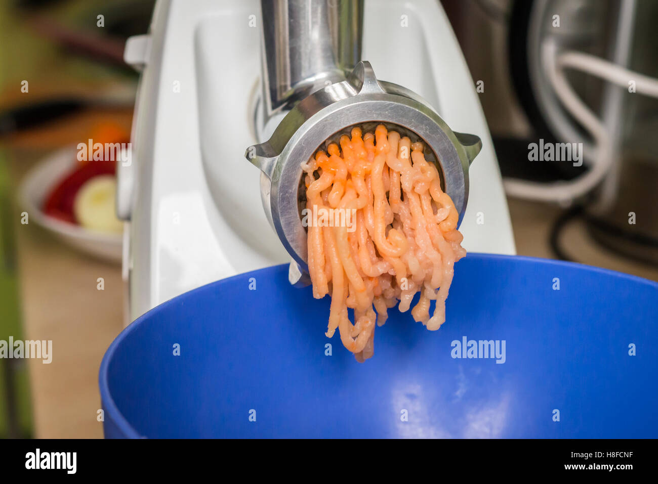 grinder grind meat for stuffing Stock Photo Alamy