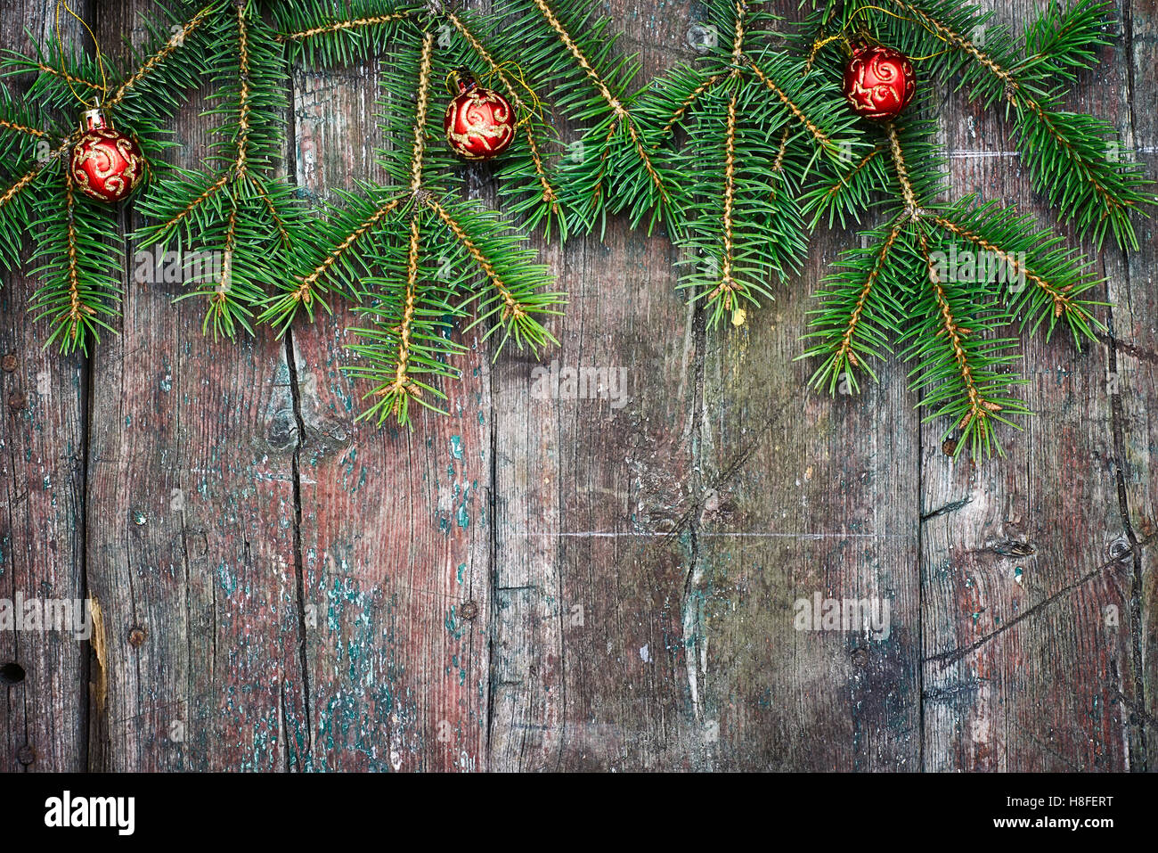 Retro wooden background with fir tree branches and Christmas