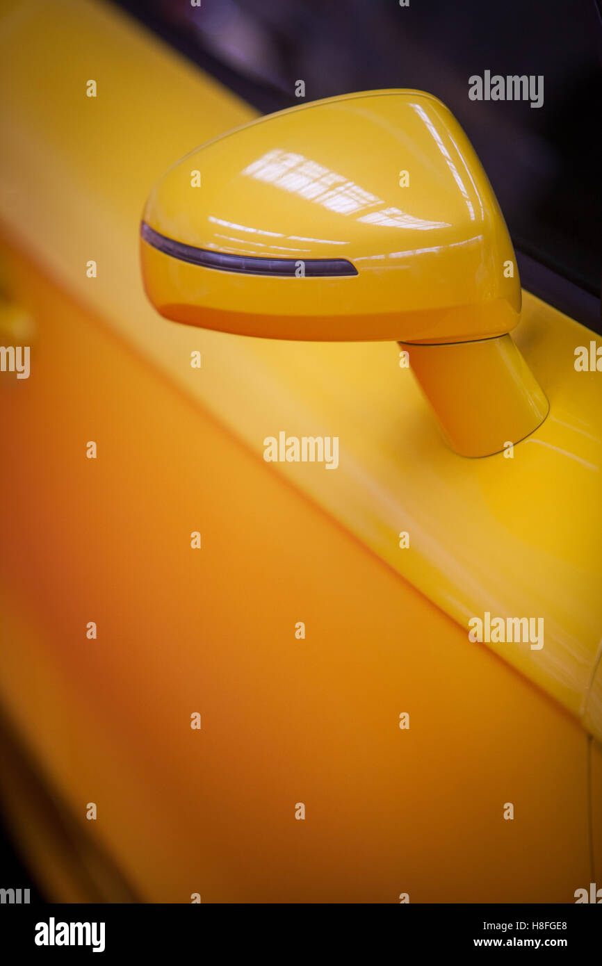 Color image of a yellow modern car side mirror Stock Photo Alamy
