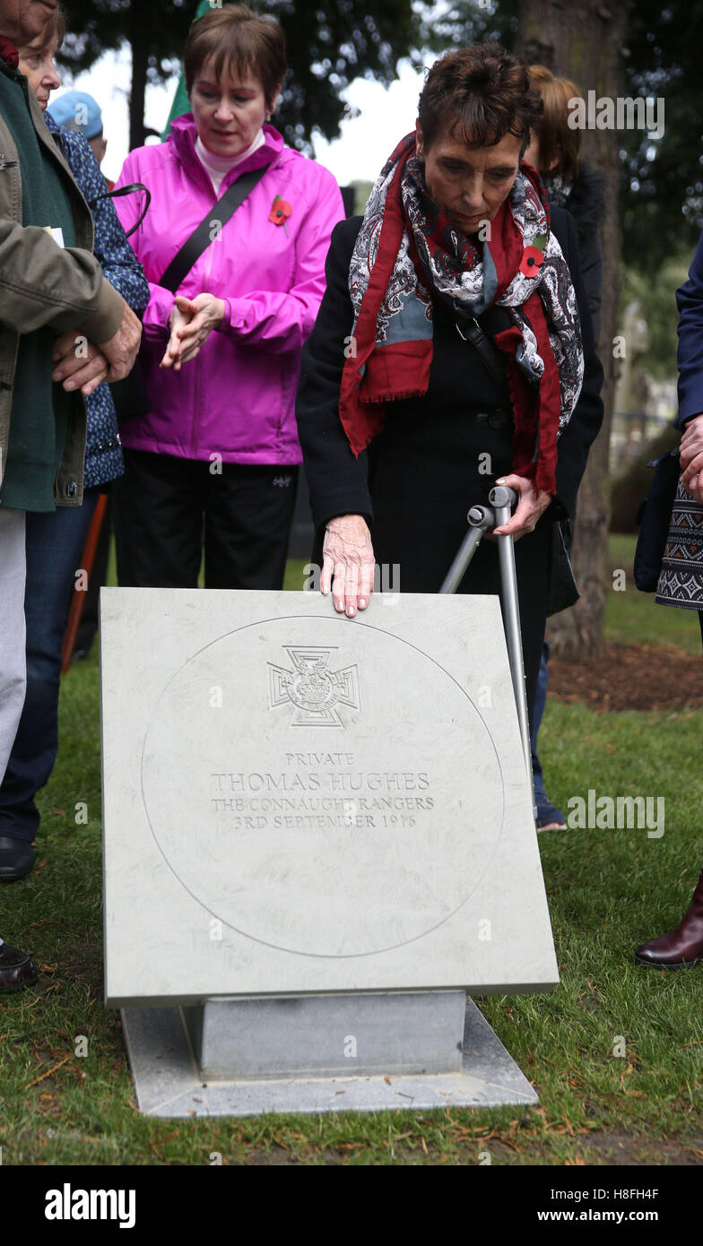Josephine Hughes touches a plaque unveiled commemorating her uncle, Private Thomas Hughes VC, at a Wreath Laying ceremony to commemorate Armistice Day at the Glasnevin cemetery in Dublin. Stock Photo