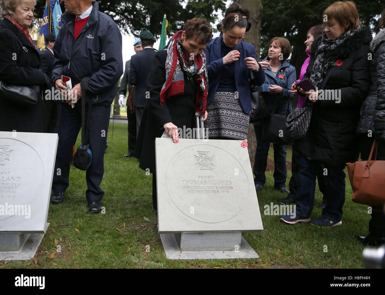 Josephine Hughes touches a plaque unveiled commemorating her uncle, Private Thomas Hughes VC, at a Wreath Laying ceremony to commemorate Armistice Day at the Glasnevin cemetery in Dublin. Stock Photo