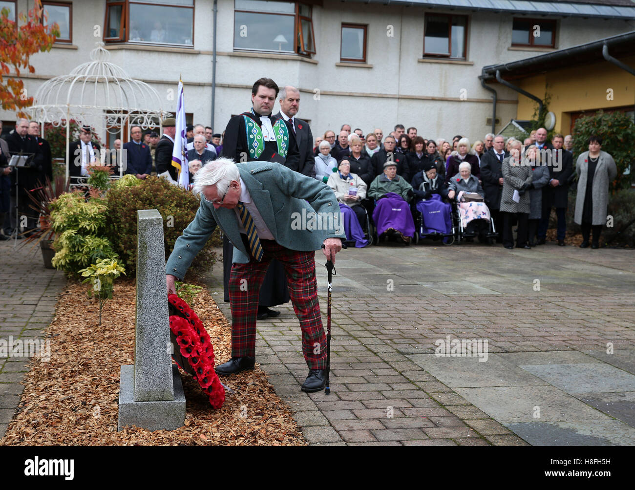 Veteran Peter Knowles (left) from the Royal Army Service Corps lays a